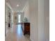 Elegant entryway with a decorative front door and antique wooden furniture at 13016 Rinella St, Venice, FL 34293
