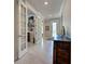 Inviting entryway with decorative tile flooring and a charming antique chest at 13016 Rinella St, Venice, FL 34293
