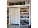 Garage storage with built-in shelving and cabinets for optimal organization at 13016 Rinella St, Venice, FL 34293
