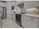 Kitchen with stainless steel refrigerator and pantry at 13016 Rinella St, Venice, FL 34293