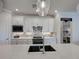 Kitchen showcasing quartz countertops, stainless appliances, and stylish backsplash at 13016 Rinella St, Venice, FL 34293