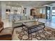 Bright living room offering kitchen and lanai access at 13016 Rinella St, Venice, FL 34293