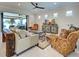 Spacious living room featuring neutral colors and access to the lanai at 13016 Rinella St, Venice, FL 34293