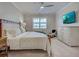 Comfortable main bedroom with a large window and ample natural light at 13016 Rinella St, Venice, FL 34293
