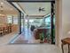 Spacious patio transitions smoothly from the indoor dining area to an outdoor living space with lake views at 13016 Rinella St, Venice, FL 34293