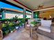 Inviting patio offers comfortable seating with views of manicured landscaping and a glimpse of the home's interior at 13016 Rinella St, Venice, FL 34293