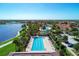 Relaxing community lap pool by the lake and lush landscaping at 13016 Rinella St, Venice, FL 34293