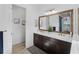 Bright bathroom featuring double sinks, a walk-in shower and tile floors at 13056 Steinhatchee Loop, Venice, FL 34293