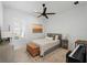 Bright bedroom featuring natural lighting, hardwood floors, and a ceiling fan at 13056 Steinhatchee Loop, Venice, FL 34293