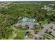 An aerial view showcases a grand community center surrounded by manicured grounds and convenient parking at 13056 Steinhatchee Loop, Venice, FL 34293