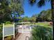 Well-maintained dog park with a shade structure and separate areas for small dogs at 13056 Steinhatchee Loop, Venice, FL 34293
