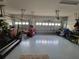 Spacious three car garage with epoxy floor has room for vehicle storage at 13056 Steinhatchee Loop, Venice, FL 34293