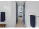 Hallway featuring wood-style floors, and blue sliding barn doors at 13056 Steinhatchee Loop, Venice, FL 34293