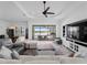 Bright living room with a ceiling fan and view of the pool at 13056 Steinhatchee Loop, Venice, FL 34293