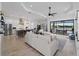 Open concept living room and kitchen with a view of the patio at 13056 Steinhatchee Loop, Venice, FL 34293