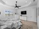 Bright main bedroom features plantation shutters, and wood floors and a ceiling fan at 13056 Steinhatchee Loop, Venice, FL 34293