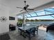 Spacious patio with seating, grill, and lake views at 13056 Steinhatchee Loop, Venice, FL 34293
