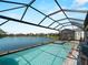 Gorgeous screened pool and spa overlooking a serene lake at 13056 Steinhatchee Loop, Venice, FL 34293