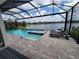 Enjoy the lake view from this luxurious pool and spa combination, perfect for relaxation and entertaining at 13056 Steinhatchee Loop, Venice, FL 34293