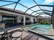 Inviting screened-in pool with a built-in spa, patio, and ample space for entertaining at 13056 Steinhatchee Loop, Venice, FL 34293