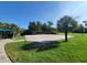 Outdoor volleyball court with lush green grass and a clear blue sky at 13056 Steinhatchee Loop, Venice, FL 34293