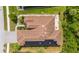 Aerial view showcases the property's tile roof, solar panels, and outdoor patio space at 13280 Campanile Ct, Venice, FL 34293
