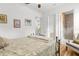 Comfortable bedroom with ceiling fan and doorway leading to the bathroom at 13280 Campanile Ct, Venice, FL 34293