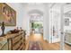 Entryway boasts hardwood floors and flows to the living area, offering an inviting entrance at 13280 Campanile Ct, Venice, FL 34293