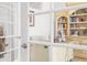 Cozy office space showcases custom cabinetry, hardwood floors, and glass paneled doors at 13280 Campanile Ct, Venice, FL 34293