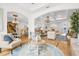 Open-concept living area with hardwood floors, chandelier, and plenty of natural light at 13280 Campanile Ct, Venice, FL 34293