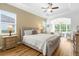 Spacious main bedroom features hardwood floors, tray ceiling, and attached sitting area at 13280 Campanile Ct, Venice, FL 34293
