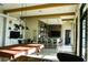 Clubhouse interior with games including billiards, a bar area, and multiple TVs at 136 Positano Trl, Nokomis, FL 34275