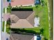 Overhead shot of the home's tile roof, landscaped backyard and the neighborhood waterfront at 13634 Vancanza Dr, Venice, FL 34293