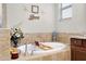 Close up of soaking tub with beach decor and relaxing accents at 13634 Vancanza Dr, Venice, FL 34293