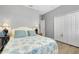 Comfortable bedroom with plush bedding and closet at 13634 Vancanza Dr, Venice, FL 34293