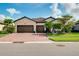 Charming single-Gathering home with a well-manicured lawn, beautiful landscaping and a brick driveway at 13634 Vancanza Dr, Venice, FL 34293