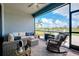 Inviting screened lanai offers comfortable seating and tranquil water views, creating a perfect outdoor retreat at 13634 Vancanza Dr, Venice, FL 34293