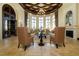 Elegant clubhouse lobby with comfortable seating, a fireplace, and arched windows at 13634 Vancanza Dr, Venice, FL 34293