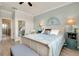 Well-lit main bedroom featuring an ensuite bathroom and a serene atmosphere at 13634 Vancanza Dr, Venice, FL 34293