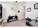 Cozy office space featuring a small sitting area and built-in shelving at 13634 Vancanza Dr, Venice, FL 34293