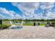 Paver patio with picturesque water views, perfect for outdoor dining and relaxation at 13634 Vancanza Dr, Venice, FL 34293