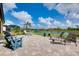 Paver patio with picturesque water views, lounge chairs and additional seating at 13634 Vancanza Dr, Venice, FL 34293