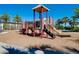 Community playground featuring play structure and safety mulch at 13634 Vancanza Dr, Venice, FL 34293