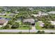 Aerial view of waterfront home with lush surroundings and canal access at 14398 Fort Worth Cir, Port Charlotte, FL 33981