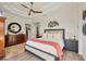 Beautiful bedroom boasts trey ceilings, neutral decor, and a modern ceiling fan and decorative wall art at 14398 Fort Worth Cir, Port Charlotte, FL 33981