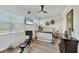 Bright bedroom with natural light, a ceiling fan, and ample space for relaxation and wellness activities at 14398 Fort Worth Cir, Port Charlotte, FL 33981
