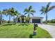 Attractive home showcasing manicured lawn and established landscaping at 14398 Fort Worth Cir, Port Charlotte, FL 33981