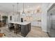 Modern kitchen featuring a center island with bar stool seating, recessed lighting, and stainless steel appliances at 14398 Fort Worth Cir, Port Charlotte, FL 33981