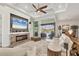 Spacious living room features a stone fireplace, a large sectional sofa, and access to the lanai at 14398 Fort Worth Cir, Port Charlotte, FL 33981