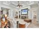 Bright living room featuring a stone fireplace, coffered ceilings, and views into the entryway at 14398 Fort Worth Cir, Port Charlotte, FL 33981